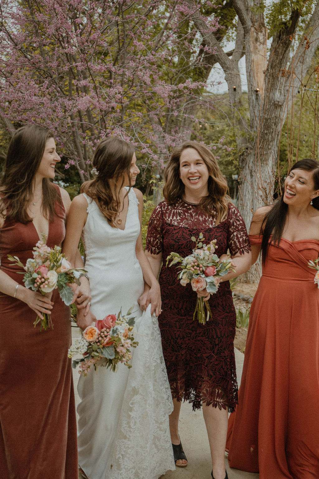 the bridesmaids all laughing together at the California wedding venue