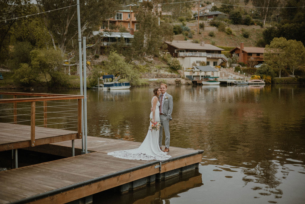 the couple is on the dock at their California Wedding Venue
