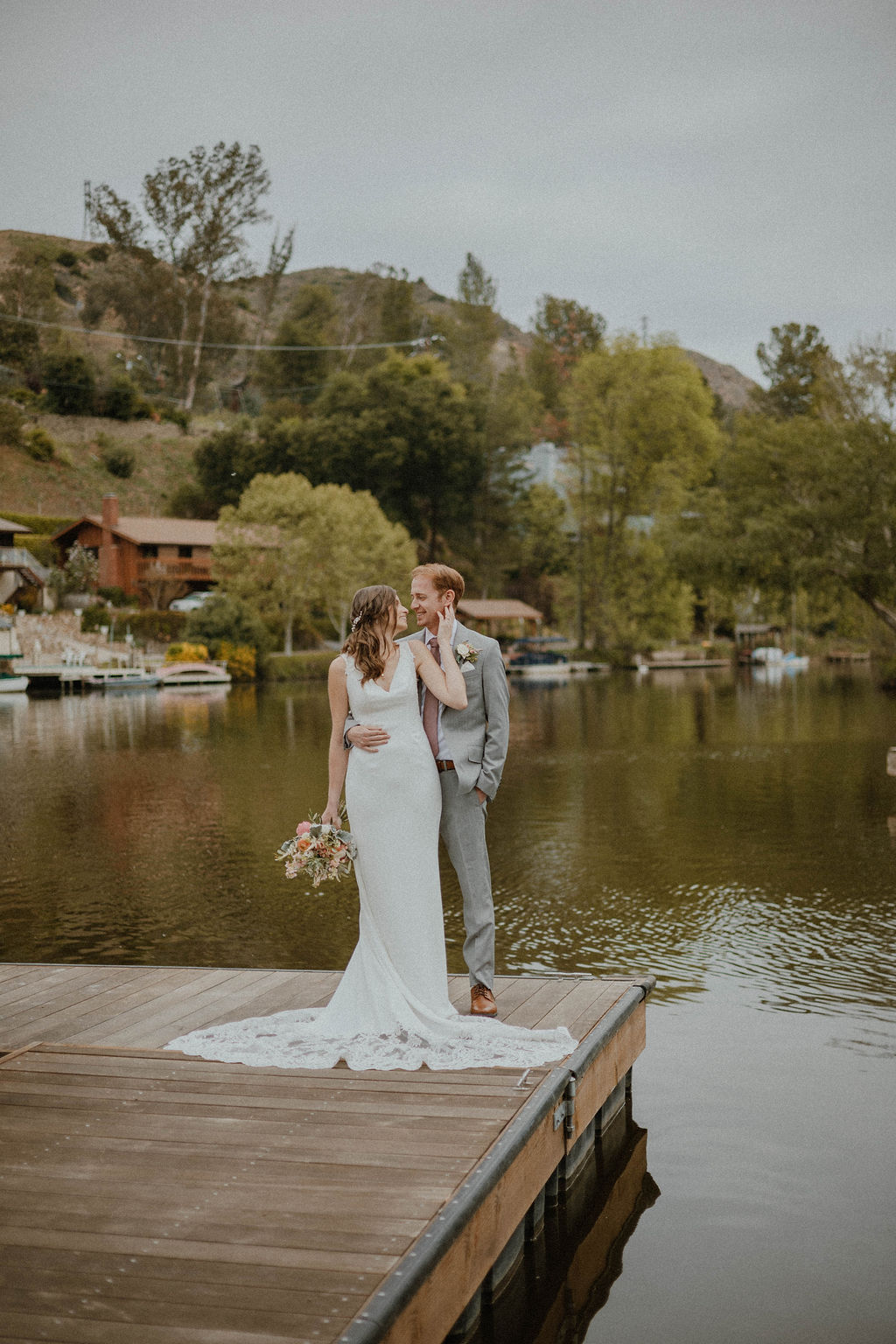 the wife gently touches the groom's cheek at the California wedding venue