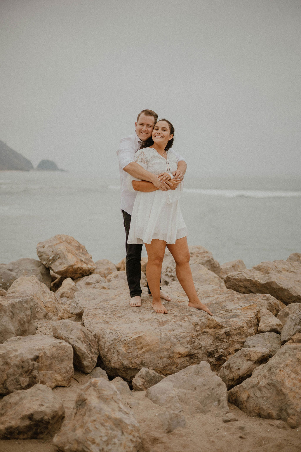 couple standing at Point Mugu Naval Base for their engagement session