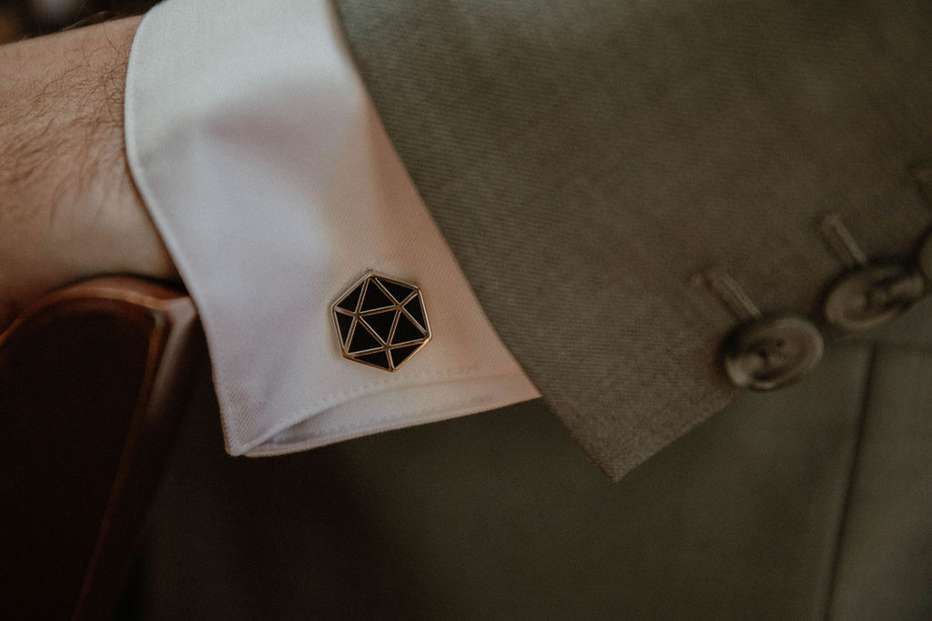 the small details on the groom's sleeve