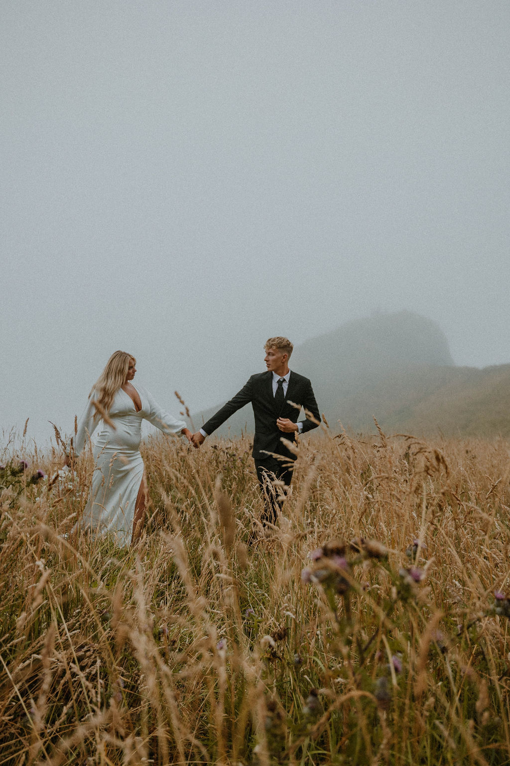 the wedding couple walking through God's Thumb at the their Oregon elopement