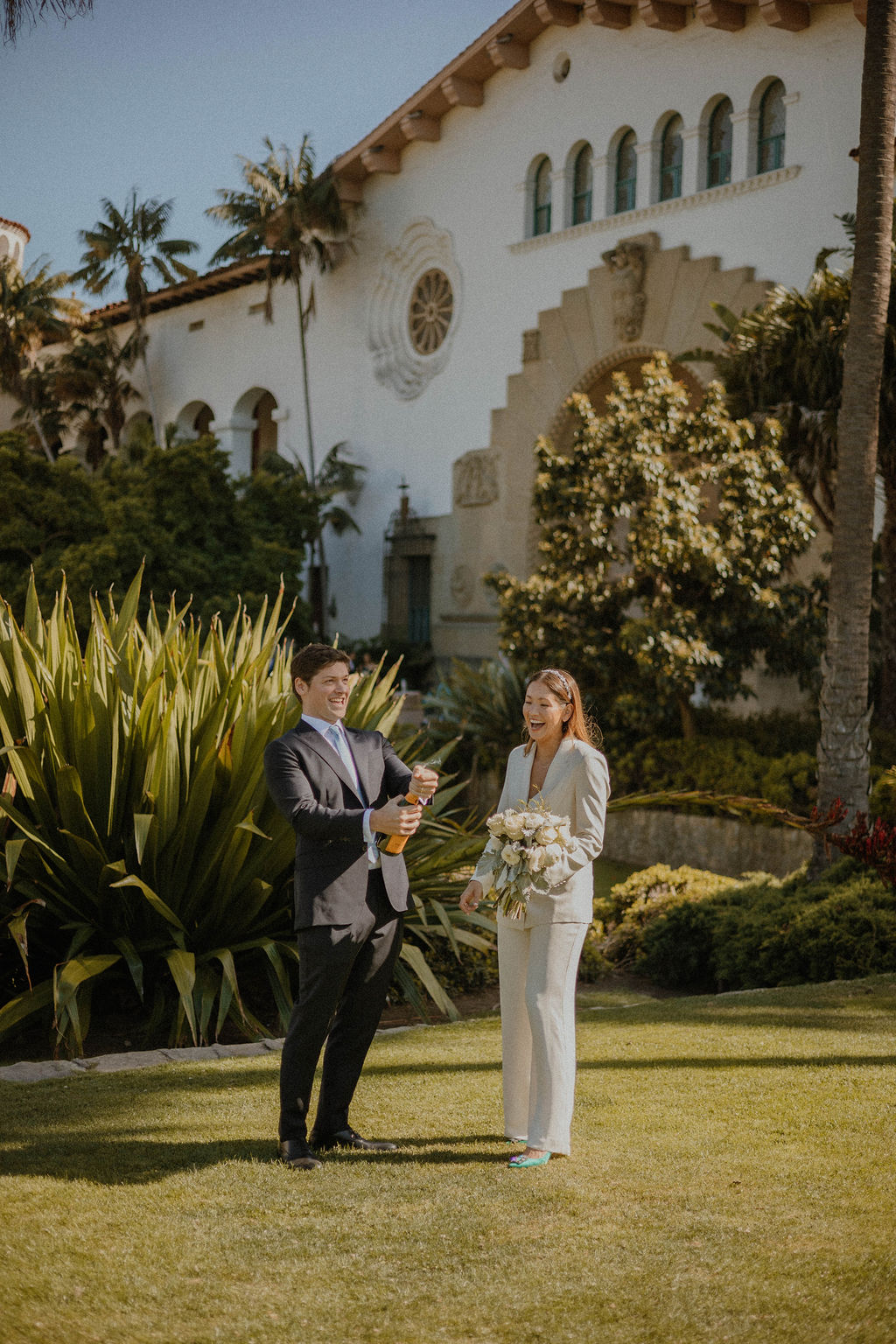 the couple laughing together at their Santa Barbara Courthouse Wedding