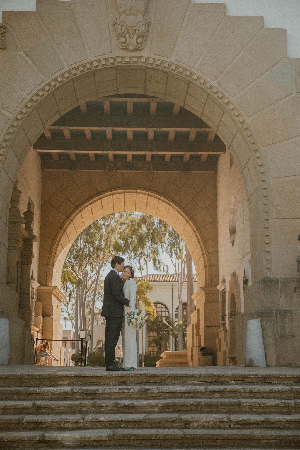 the couple standing together at their Santa Barbara Courthouse Wedding