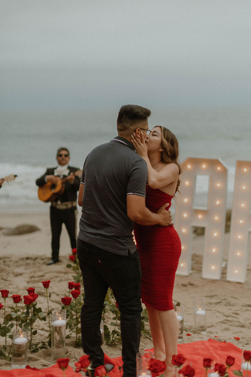 the couple kissing after their proposal