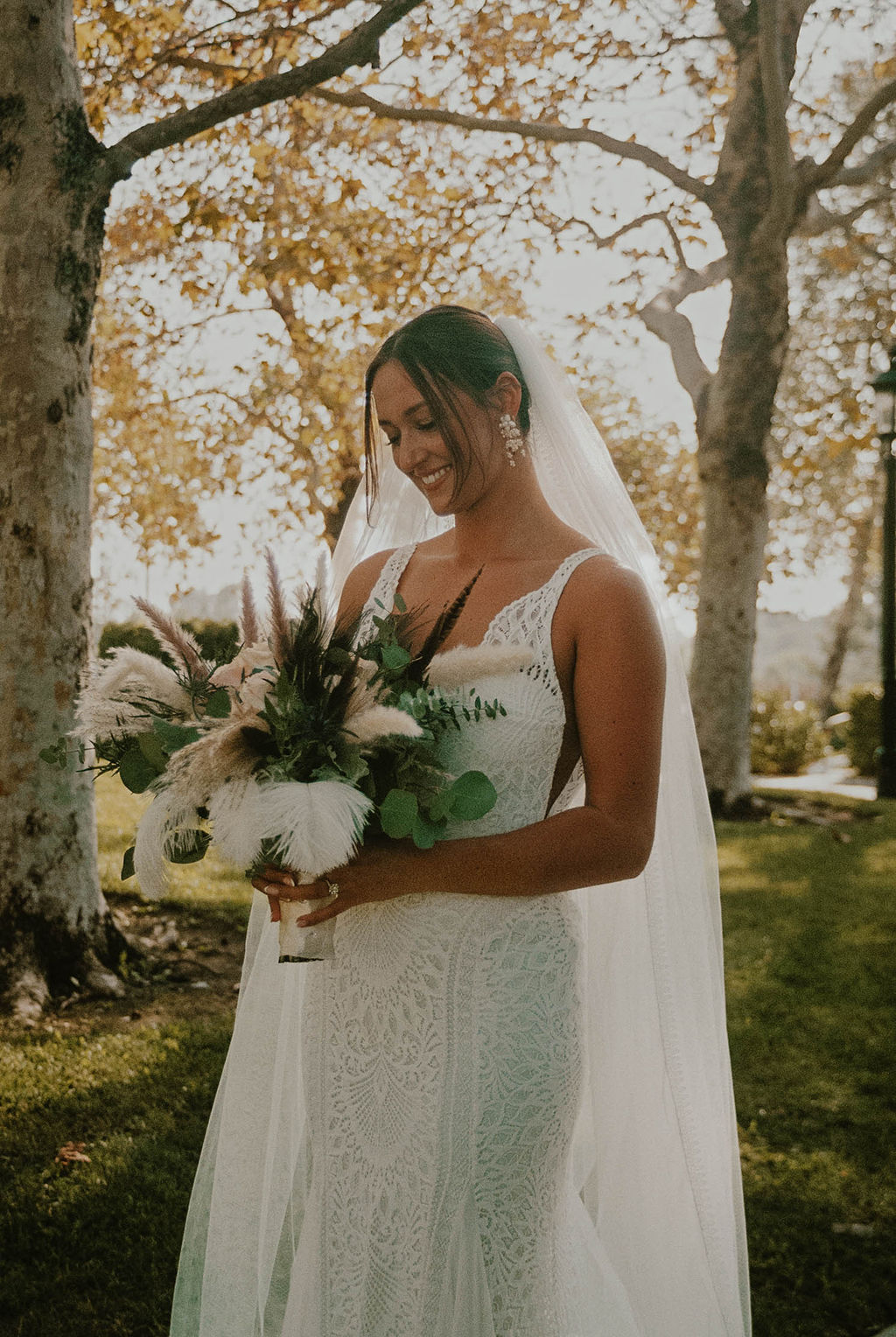 the bride holding her boho bouquet